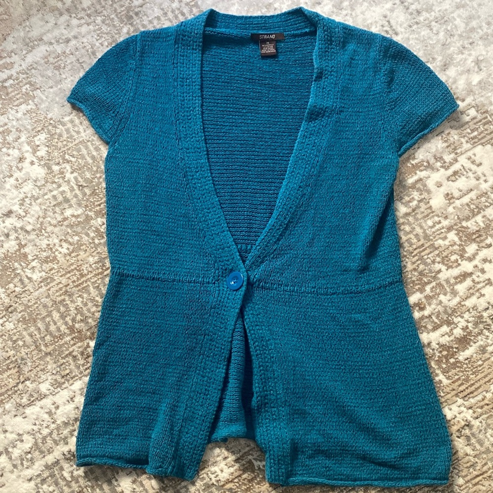 Strand teal blue knit sweater with single button closure.